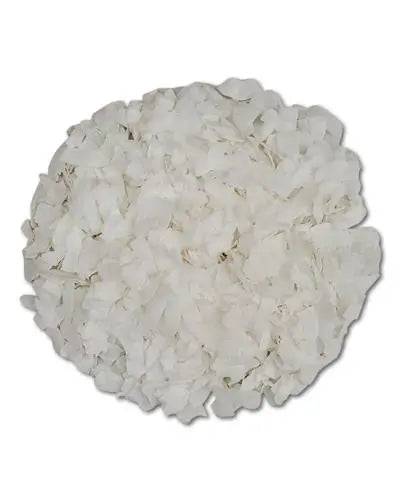Crunchy coconut chips in a pile, perfect as a wholesome, tasty treat for birds with their natural, tropical appeal.