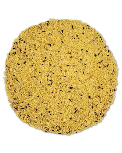 Close-up of Higgins Protein Egg Food in bulk per lb, showcasing a nutritious blend of baked eggs and grain crumbs for birds.