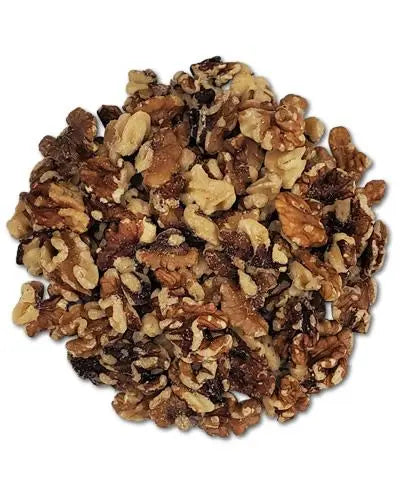 Fresh, shelled walnuts in a pile, showcasing their meaty, golden-brown texture, perfect for snacking or baking.