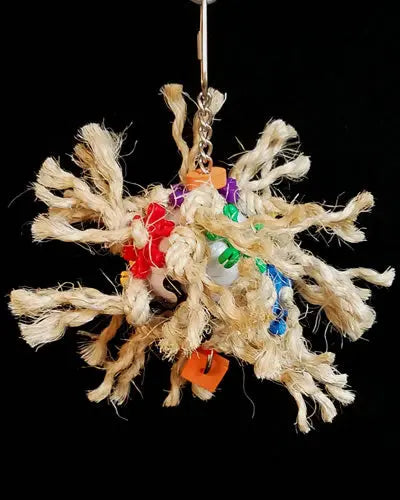 Vibrant Sisal Explosion bird toy with colorful sisal, plastic star links, and foam shapes knotted on a chained plastic ball.