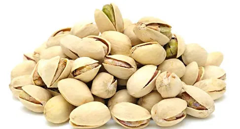 Fresh, unsalted pistachios in shell, showcasing their natural green and beige hues, perfect for snacking or foraging.