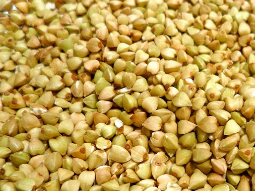 Close-up of 20lb bulk buckwheat groats, showcasing their light brown, triangular seeds, perfect for a nutritious meal.