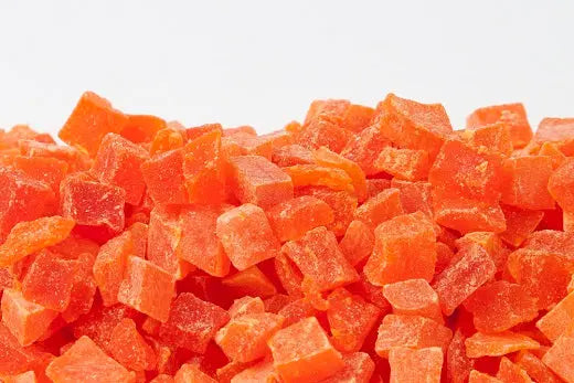Vibrant diced papaya chunks in bulk, showcasing their bright orange hue and juicy texture, perfect as a bird treat.