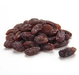 Vibrant pile of 30lb bulk raisins, showcasing their deep purple hue and wrinkled texture, perfect as a bird treat.