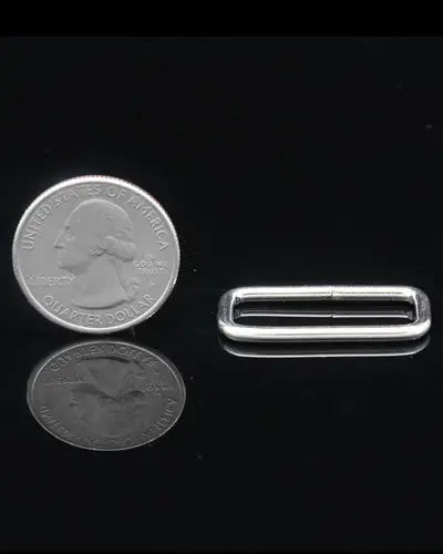 Close-up of a 1" square connector for bird toys, showcasing its sturdy, compact design with precise 1-1/4" length.
