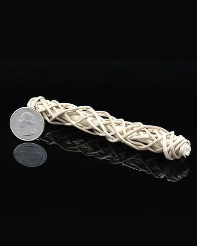Delicate wicker twist toy part, crafted from 100% natural materials, showcasing a woven texture, about 5 inches long.