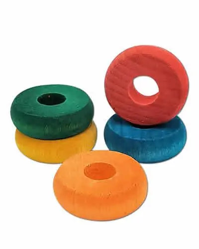 Colorful 1-1/4" pine wood donuts in a 4-pack, perfect as bird toy parts, showcasing varied hues and a smooth finish.
