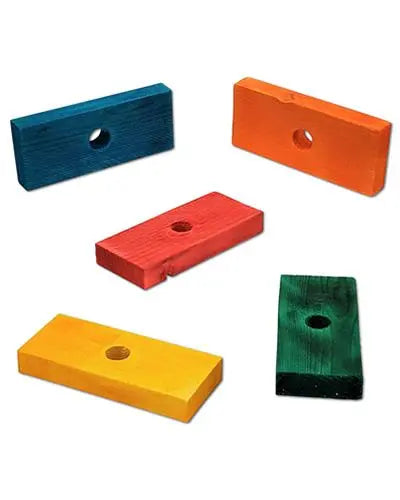 Vibrant 3.5-inch colored pine blocks stacked neatly, showcasing a variety of hues with smooth edges and drilled holes.