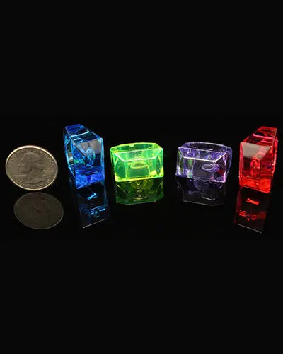 Vibrant assortment of four LG Crystal Rings, colorful plastic bird toy parts with a shiny finish, perfect for playful pets.