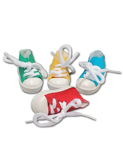 Colorful plastic sneaker-shaped bird toy with a hollow design, perfect for hiding treats and engaging playful birds.