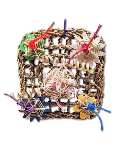 Colorful small vine mat toy by Happy Beaks USA, adorned with foam flowers, curly bamboo, poly rope, and a treat-filled munch ball.
