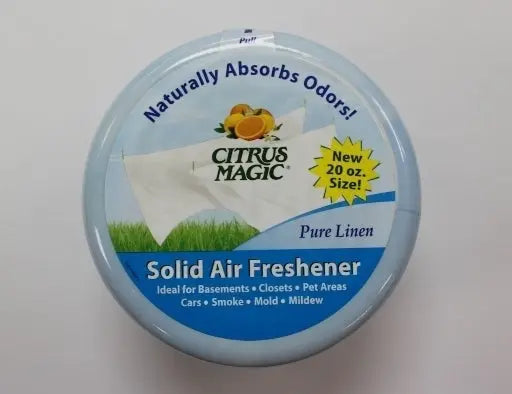 Refreshing 20oz Citrus Magic Pure Linen Solid Air Freshener, emanating a light, clean scent in a vibrant package.