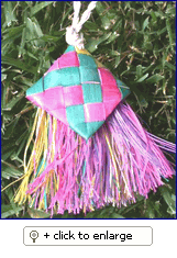 Colorful Mini Bird Brush toy made of natural palm leaf, designed for small birds to shred and enjoy, measuring 5x2 inches.
