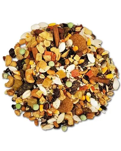 Vibrant mix of Madagascar Island bird food with colorful fruits, nuts, and seeds like bananas, mango, and almonds.