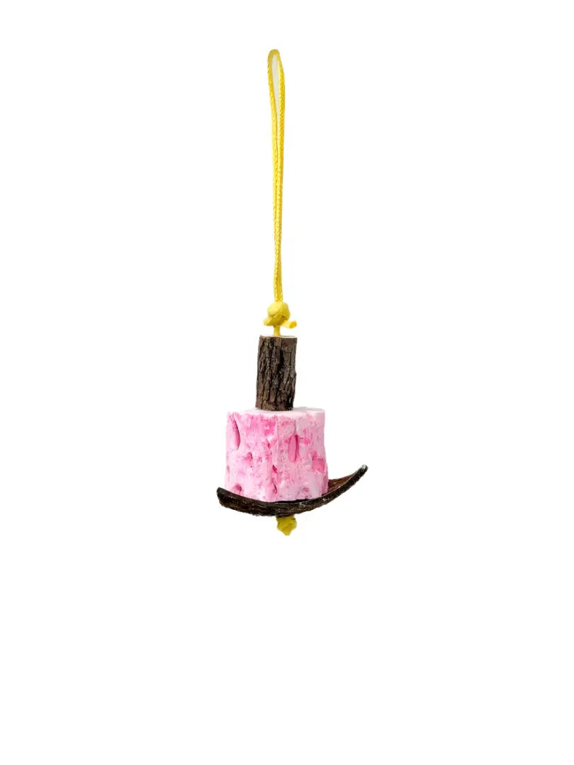 Colorful Tooty Chews - Polly's bird toy with edible mineral block, enriched with calcium, hanging on a bird-safe rope.