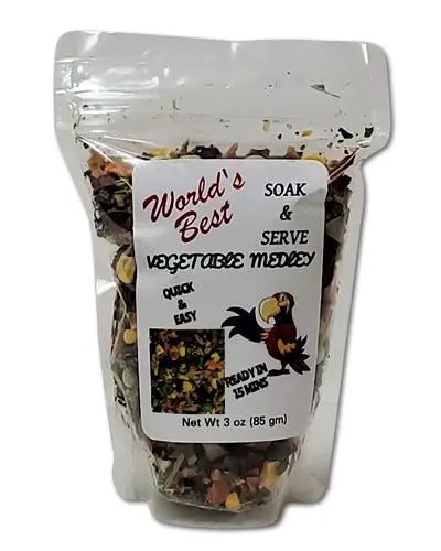 Vibrant mix of Soak & Serve Vegetable Medley by World's Best, showcasing colorful, natural bird food in a 3oz pack.