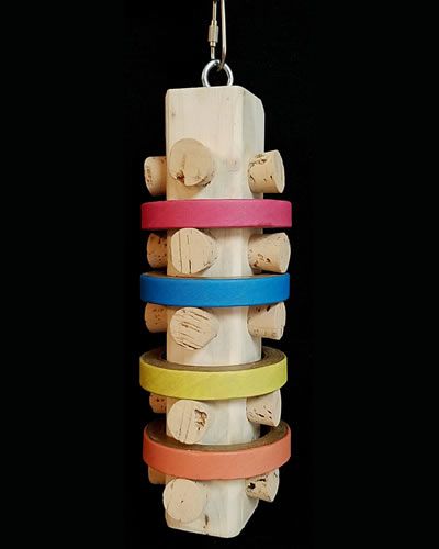 Vibrant bird toy featuring 20 natural corks and four colorful birdie bagels on a sturdy dyed wood base, perfect for play.