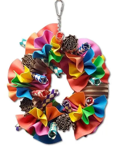 Vibrant Ruffle Swing bird toy with colorful foam sheets, bamboo finger traps, and treat-filled cardboard rolls for playful birds.