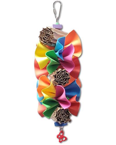 Vibrant bird toy with ruffled colorful foam sheets, corrugated cardboard rolls, and a playful plastic animal at the base.
