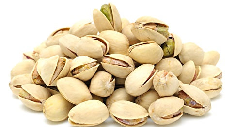 Fresh, unsalted pistachios in shell, showcasing their natural green and beige hues, perfect for snacking or foraging.