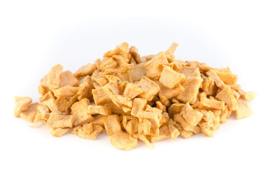 Fresh diced apples in bulk, showcasing vibrant red and green chunks, perfect as a nutritious treat for birds.