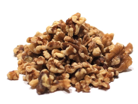 Fresh, unsalted walnut pieces in a 25lb bulk pack, showcasing their meaty texture, perfect for snacking or foraging.