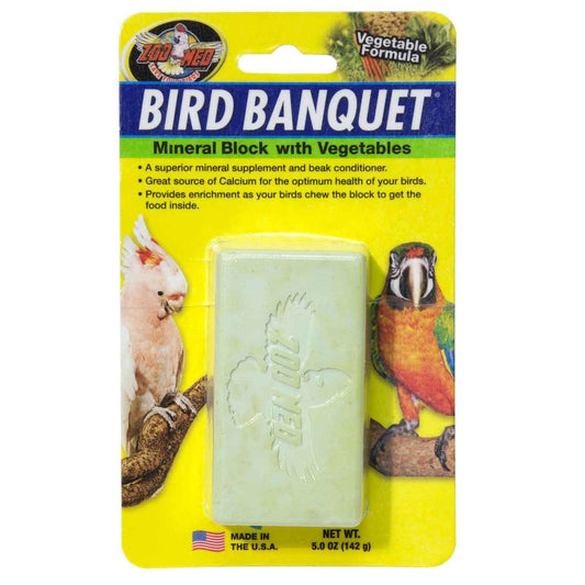 Vibrant mineral block for birds, packed with veggies like carrots and spinach, offering calcium and beak-trimming benefits.