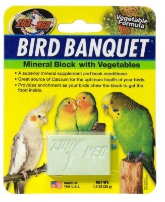 Vibrant mineral block for birds, packed with veggies like carrots and spinach, offering calcium and beak-trimming fun.