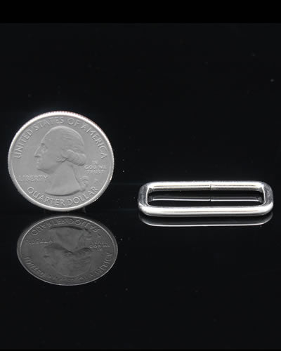 Close-up of a 1" square connector for bird toys, showcasing its sturdy, compact design with precise 1-1/4" length.