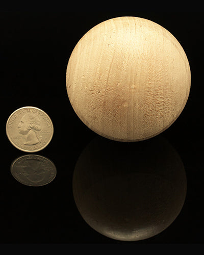 Natural 2.5-inch wooden ball, perfect for crafting bird toys, showcasing a smooth, round texture and earthy tone.