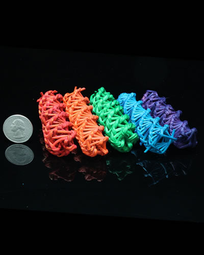 Vibrant Colored Vine "DNA" bird toy parts, showcasing a twisted, natural design in assorted hues, measuring about 3.25 inches long.