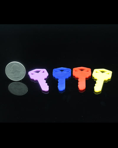 Brightly colored 2-inch plastic keys in assorted shades, perfect as engaging bird toy parts with a playful design.