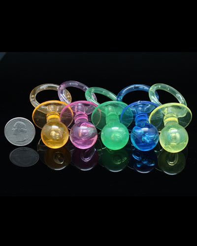 Vibrant acrylic pacifiers in assorted colors, perfect for crafting unique toys or as playful foot toys for pets.