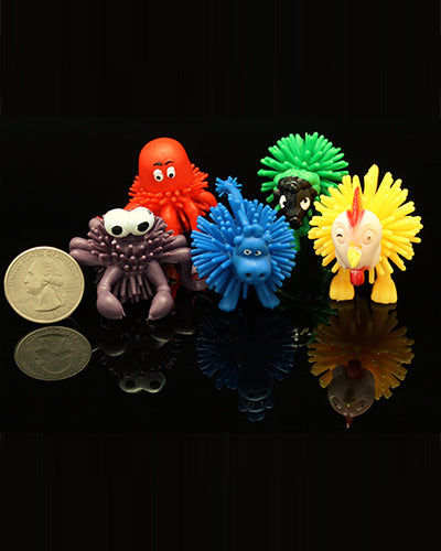 Colorful plastic spike balls shaped like assorted animals, perfect as bird toy parts, measuring 1-3/4 inches in size.