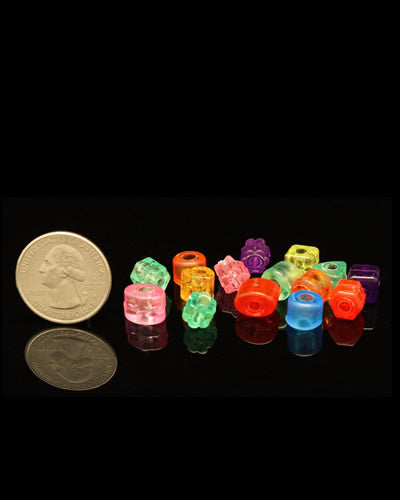 Vibrant assortment of 20 clear plastic beads in various colors and shapes, perfect for crafting bird toys, each 3/16" in diameter.