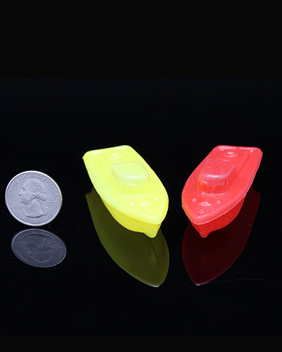 Colorful set of four plastic boat-shaped bird toys, each measuring 3 inches long, perfect for playful pet birds.
