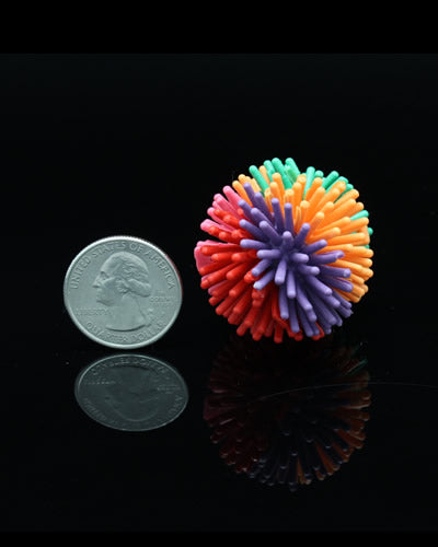 Colorful Md 'Koosh' Ball toy for birds, featuring a vibrant, spiky design with a 1.5-inch diameter for playful pecking.