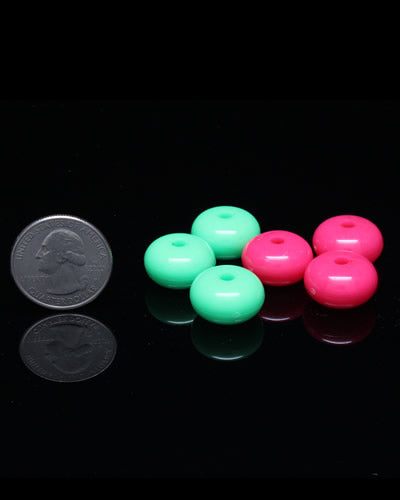 Vibrant assortment of small oval plastic beads in a 6-pack, perfect for bird toys, each about 3/4 inch wide with a tiny hole.