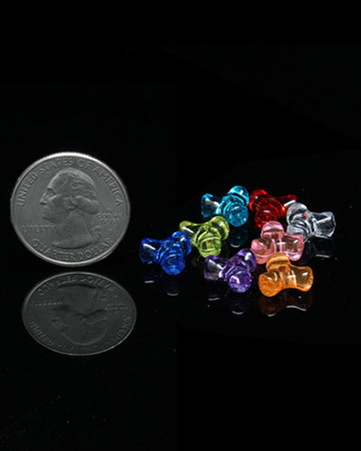 Colorful mini triangle beads in assorted hues, perfect for crafting bird toys, with about 190 tiny plastic pieces per ounce.