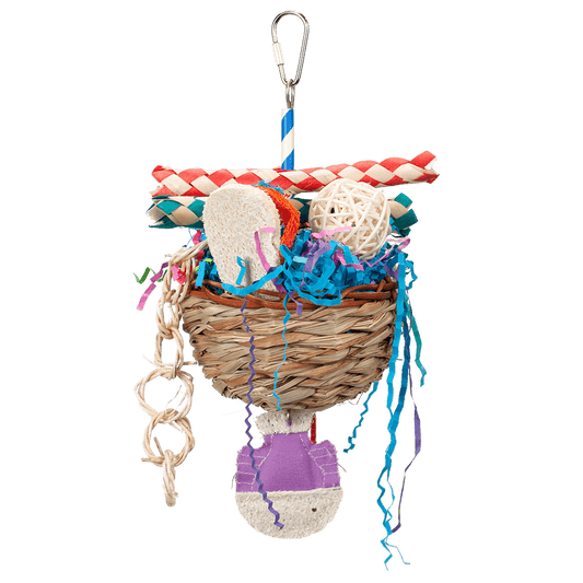 Colorful Happy Beaks Tackle Box toy with a palm and wicker basket, stuffed with crinkle paper, loofah, and vine balls for birds.