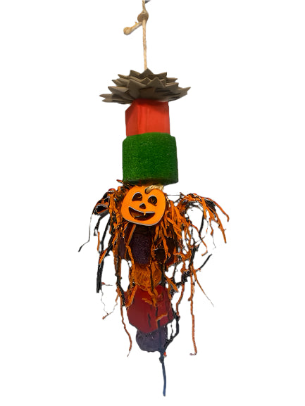 Colorful Happy Beaks Spooky Loofah bird toy with wooden blocks, vine balls, and crinkle paper on a sisal rope.