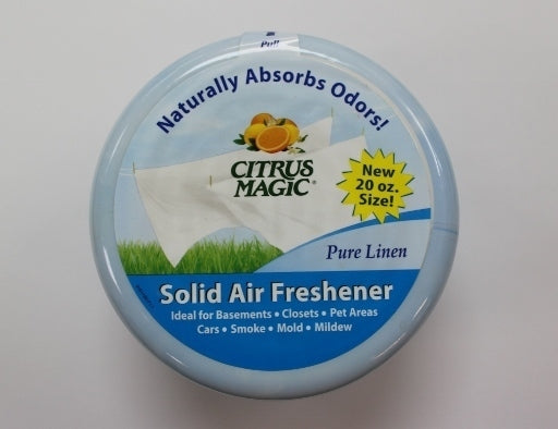 Refreshing 20oz Citrus Magic Pure Linen Solid Air Freshener, emanating a light, clean scent in a vibrant package.