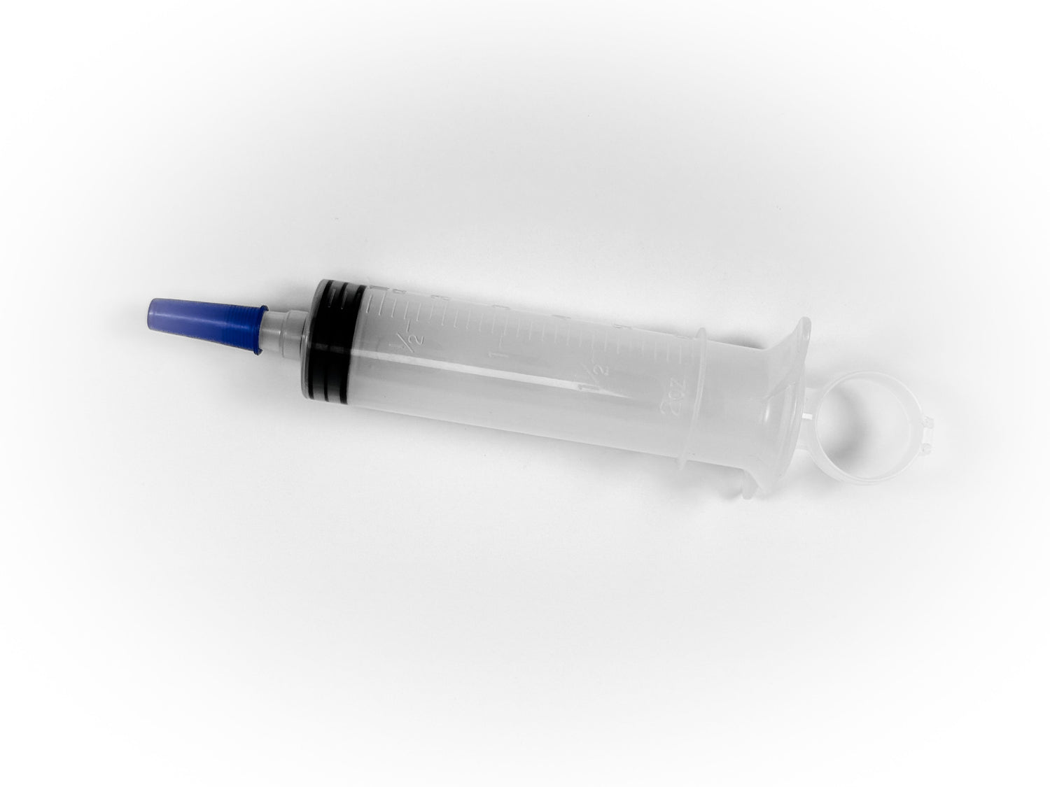 Close-up of a 60cc thumb control ring syringe with a clear barrel and secure thumb ring for precise control.