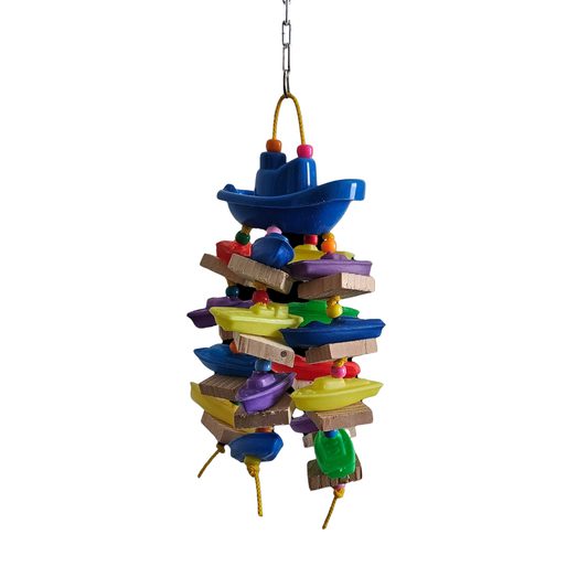 Colorful Tuggin Boats bird toy with textured ropes and vibrant wooden blocks, perfect for playful pecking and pulling.