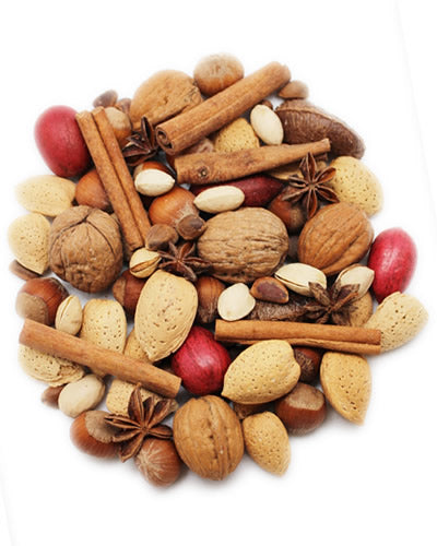 Vibrant mix of Patagonian in-shell nuts like pecans and almonds with aromatic whole cinnamon sticks and star anise.