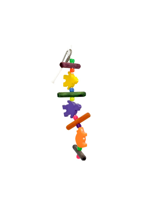 Vibrant Biquet Zoo Max parrot toy with yellow and purple puzzle pieces, wooden dowels, bright beads, and an orange head accent.