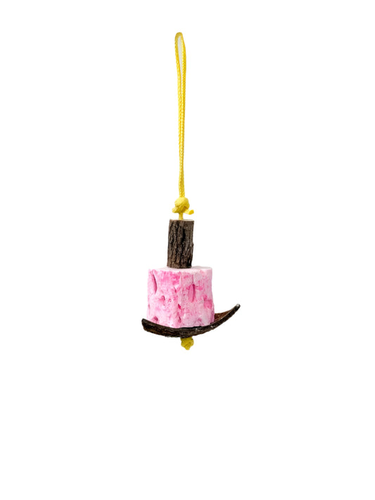 Colorful Tooty Chews - Polly's bird toy with edible mineral block, enriched with calcium, hanging on a bird-safe rope.