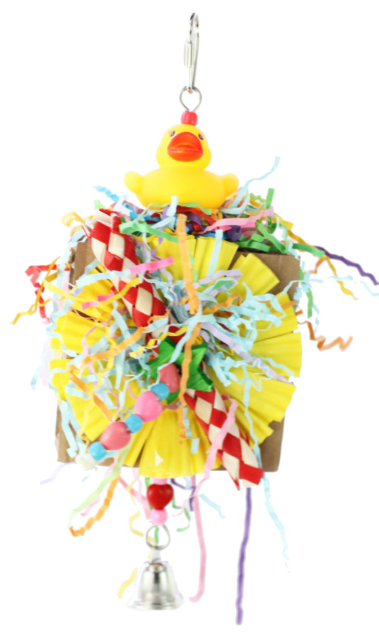 Colorful Quack's of Fun Happy Beaks bird toy with finger traps, crinkle paper, and plastic beads on corrugated cardboard.